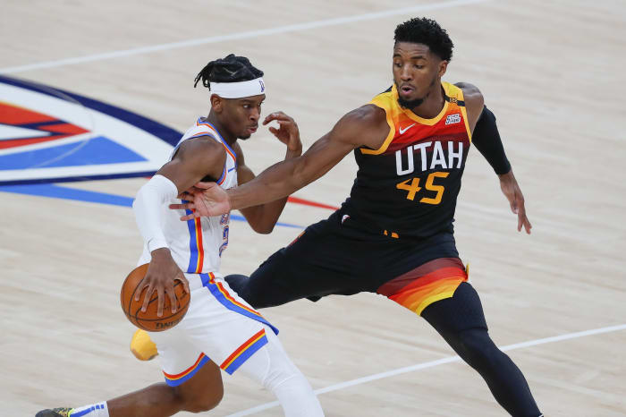 Donovan Mitchell (45) goes for a steal against the Oklahoma City Thunder